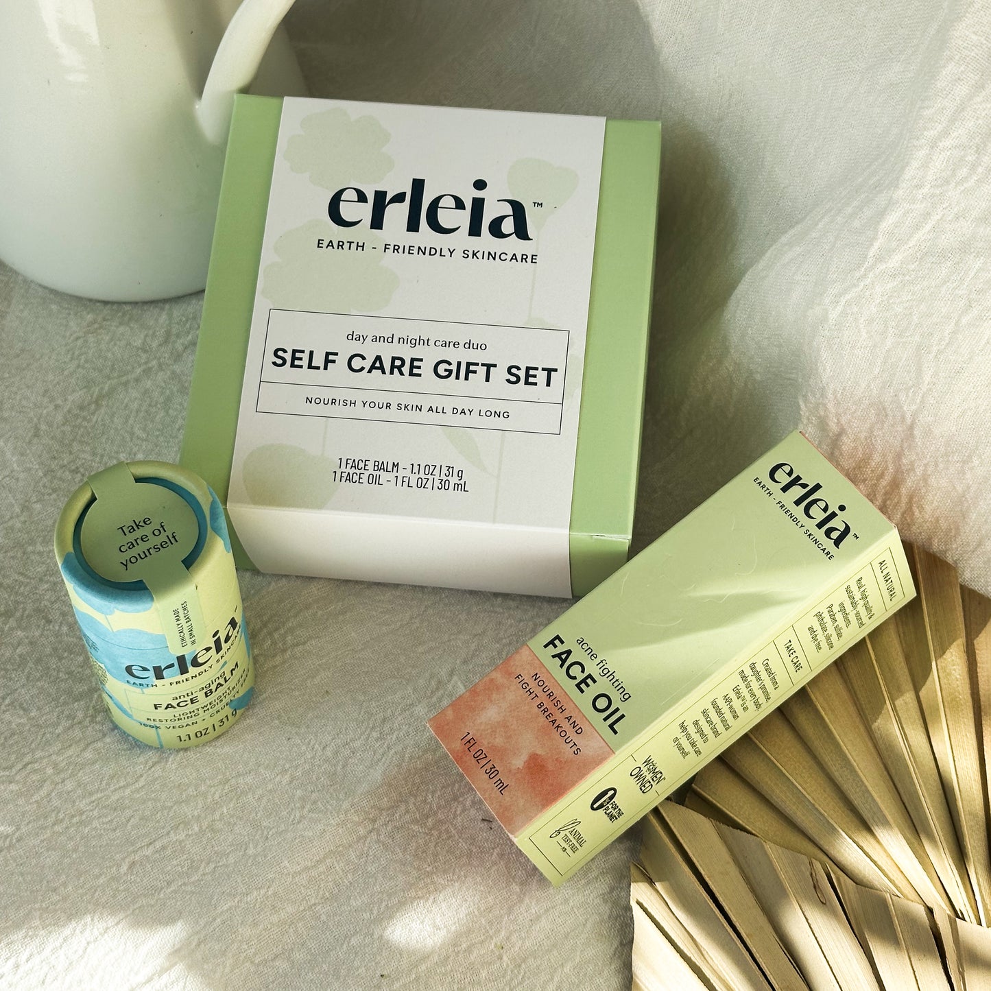 Erleia Day and Night Care Duo Self Care Set - With Acne FIghting Face Oil & Anti-Aging Face Balm and palm leaves