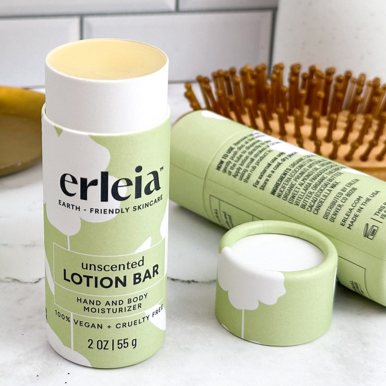 An Erleia unscented lotion bar, uncapped and open on a bathroom counter