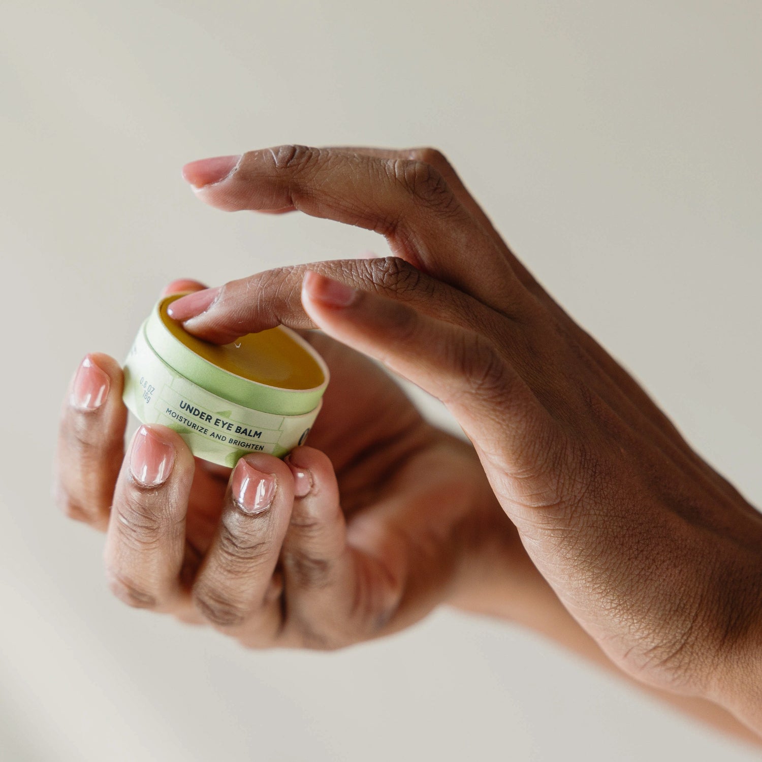 Erleia Under Eye Balm being used by a Black person