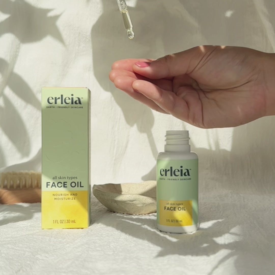 Short video clip, no audio, of the Erleia Face Oil - All Skin Types being swatched on an East Asian hand. It is a translucent light yellow viscous oil that absorbs quickly.
