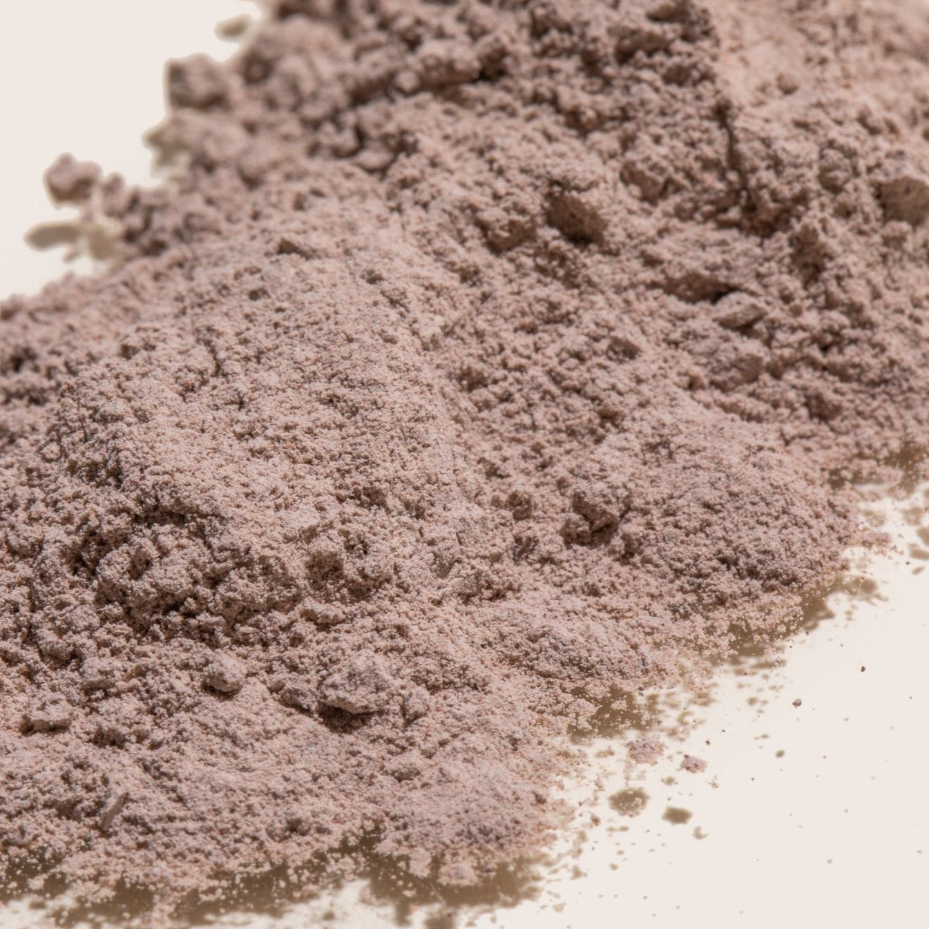 Erleia Signature Clay Mask powder - a light reddish brown fine powder