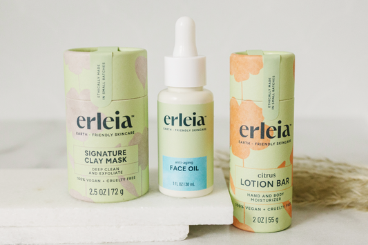 3 Erleia products on a white background - the Signature Clay Mask, Face Oil - Anti-Aging and Lotion Bar - Citrus