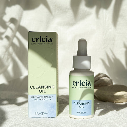 Erleia Cleansing Oil Bottle and Box on a white warm background with shadows