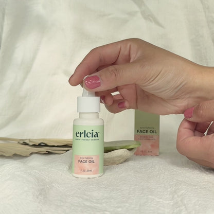 Short video clip, no audio, of the Erleia Face Oil - Acne FIghting being swatched on an East Asian hand. It is a translucent light yellow viscous oil that absorbs quickly.